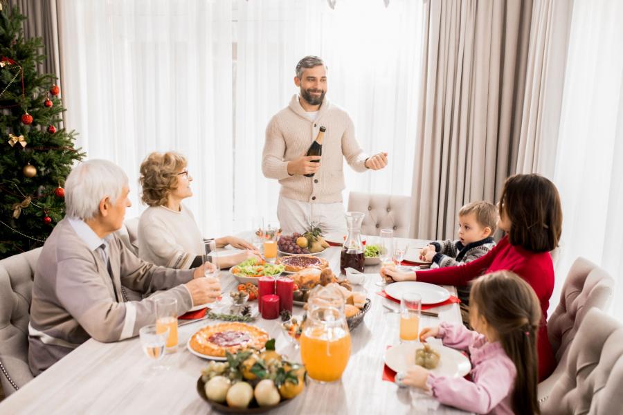 family celebrating christmas at table